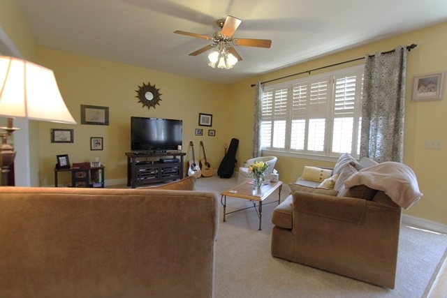 241 Starcrest Road Charlottesville, VA 22902 - Photo 14 of 29 a living room with furniture a flat screen tv and a large window