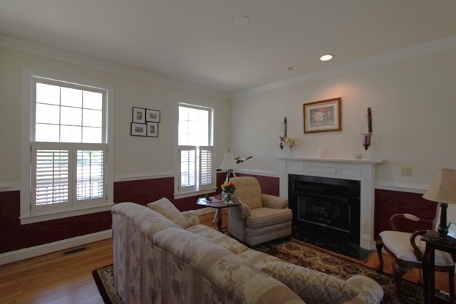 241 Starcrest Road Charlottesville, VA 22902 - Photo 3 of 29 a living room with furniture and a fireplace