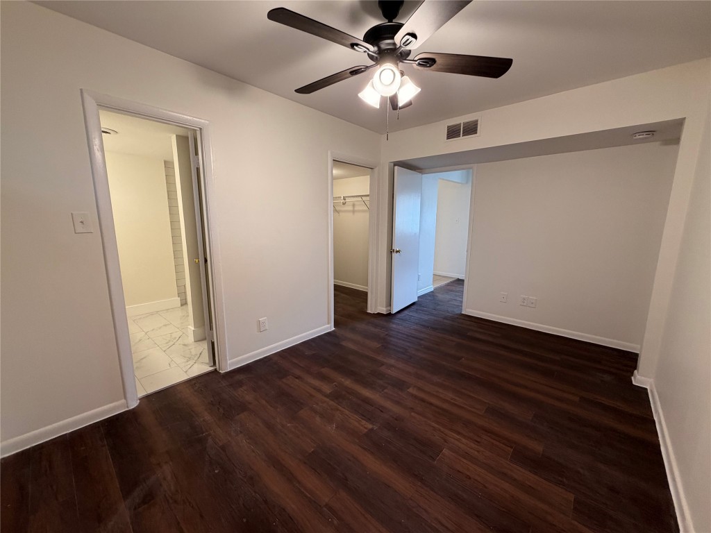 3304 Red River Street, Unit 206 Austin, TX 78705 - Photo 6 of 16 a view of an empty room with wooden floor