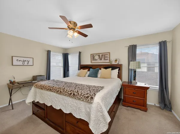 a bedroom with bed and window