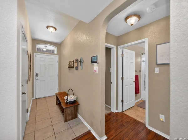 a view of a hallway with seating area