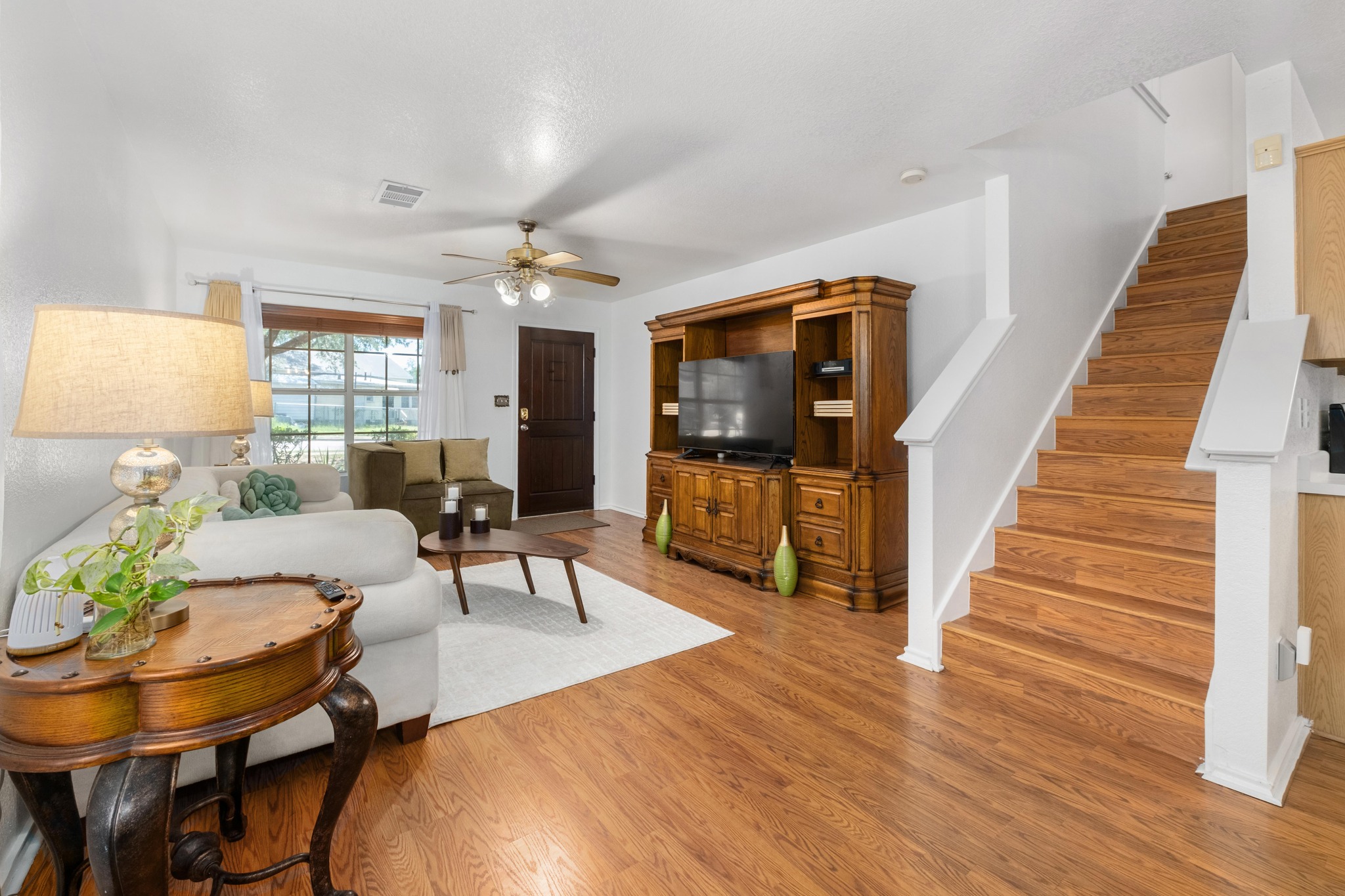 1184 Waller Street Austin, TX 78702 - Photo 3 of 19 a living room with furniture and a wooden floor
