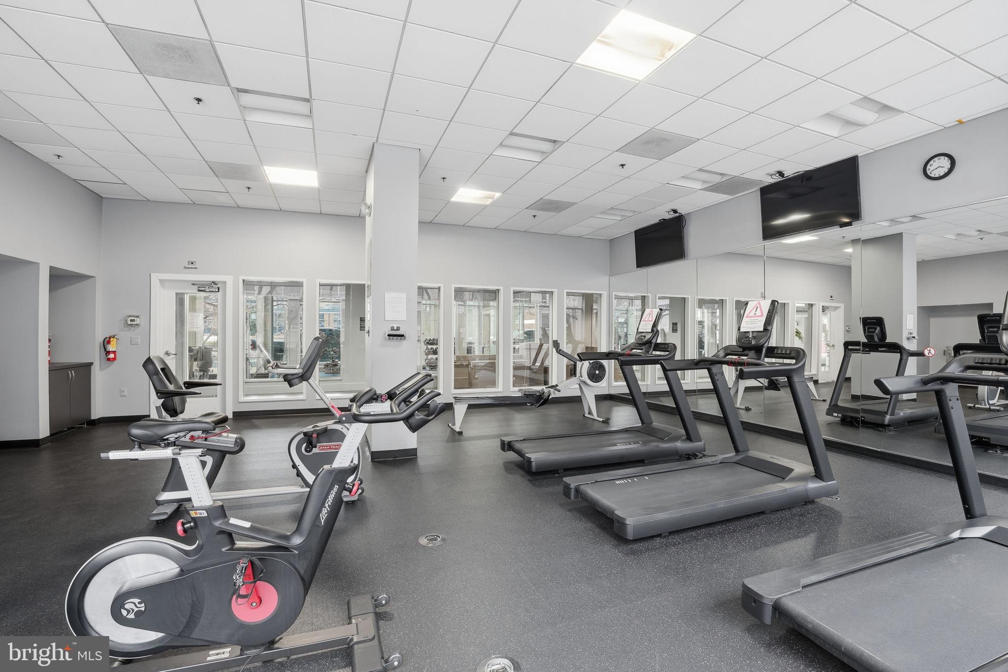350 G Street Southwest, Unit N302 Washington, DC 20024 - Photo 17 of 32 a living room with lots of furniture and white walls