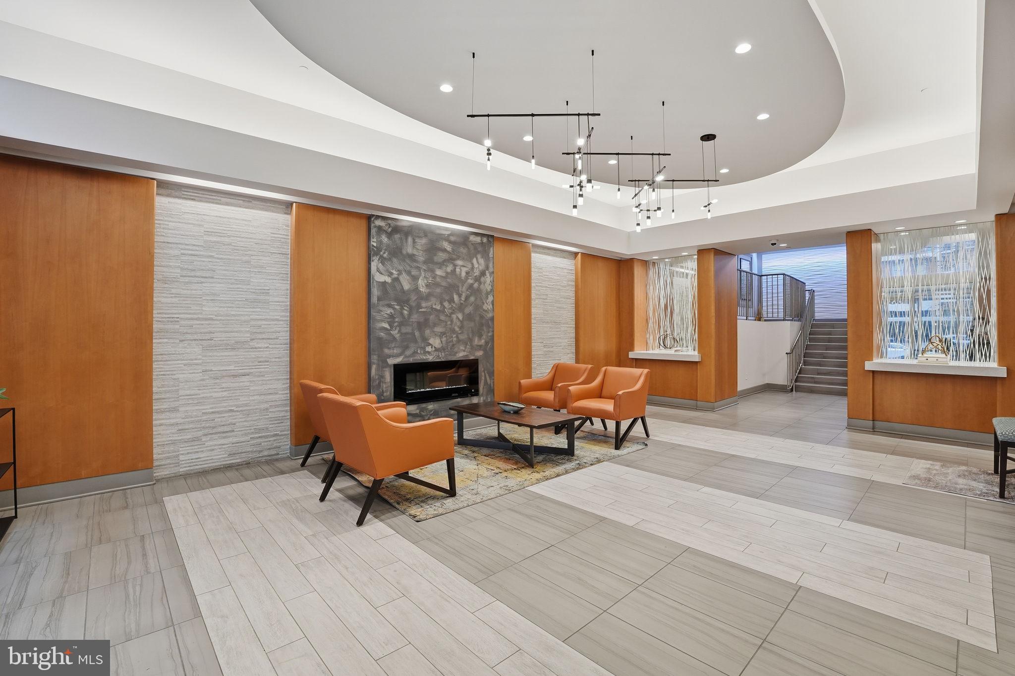 350 G Street Southwest, Unit N302 Washington, DC 20024 - Photo 19 of 32 a living room with furniture and a large window