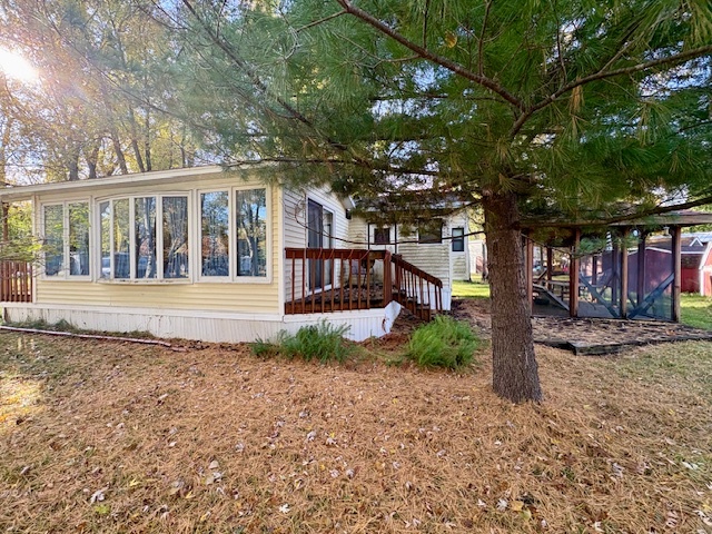 4-20 Woodhaven Sublette, IL 61367 - Photo 4 of 26 a view of a house with a yard and large tree
