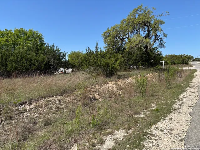 a view of a lake with houses in the background