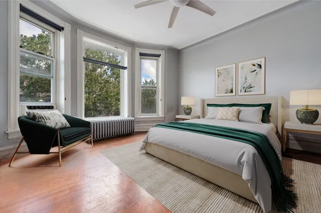 a bedroom with a bed and a couch