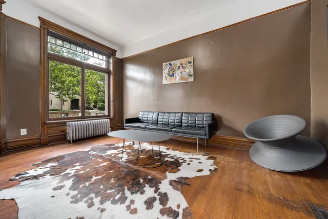 a living room with a couch and a large window