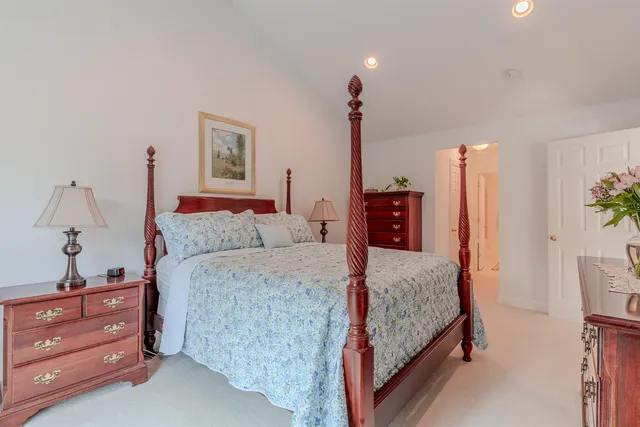 a bedroom with a bed and a dresser