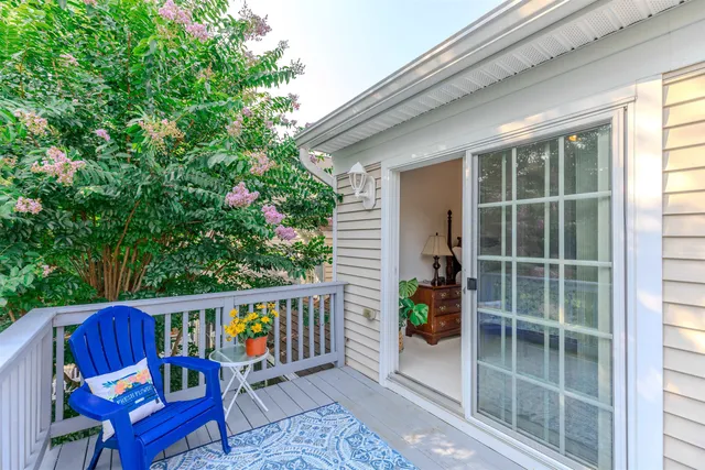a view of a two chairs in the balcony