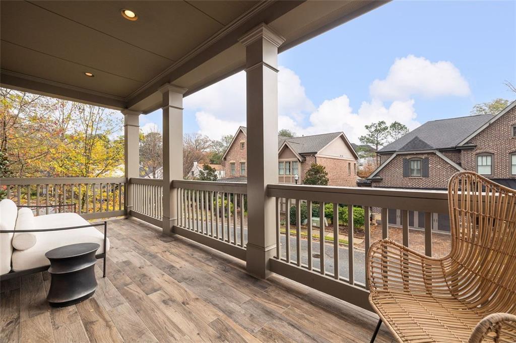 101 Walden Square Way Decatur, GA 30030 - Photo 22 of 33 a view of a balcony with wooden floor and furniture