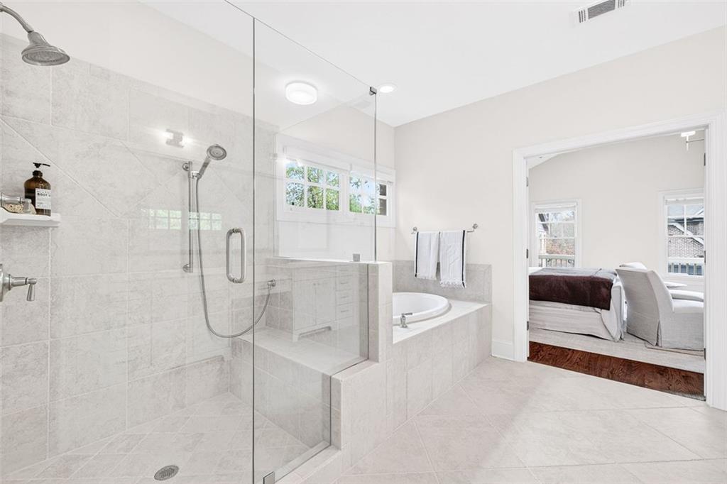 101 Walden Square Way Decatur, GA 30030 - Photo 26 of 33 a spacious bathroom with a double sink shower and bathtub