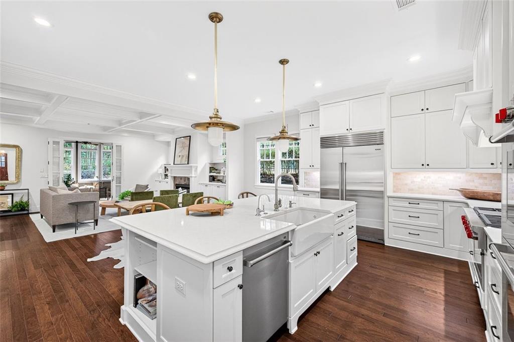 101 Walden Square Way Decatur, GA 30030 - Photo 7 of 33 a large white kitchen with cabinets