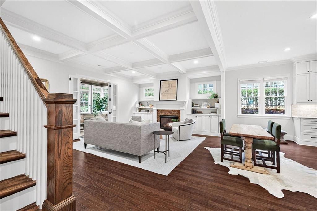 101 Walden Square Way Decatur, GA 30030 - Photo 10 of 33 a living room with furniture a large window wooden floor and a rug