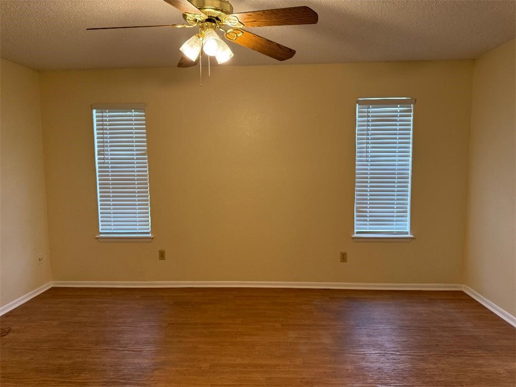 110 Timberview Drive Portland, TX 78374 - Photo 15 of 30 a view of an empty room with wooden floor and a window