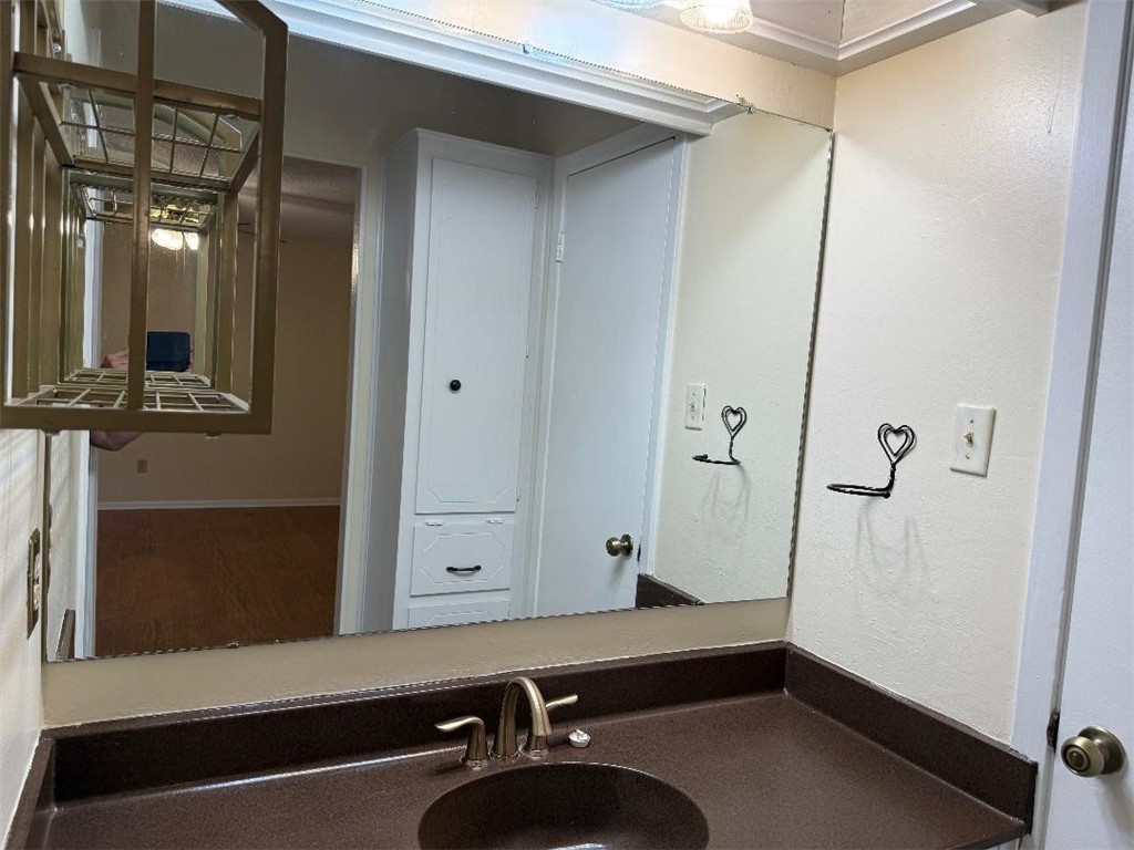 110 Timberview Drive Portland, TX 78374 - Photo 19 of 30 a bathroom with a sink and a mirror