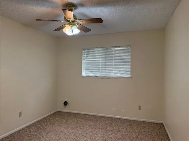 an empty room with fan