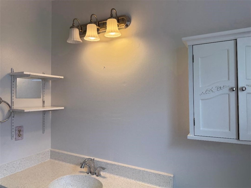 110 Timberview Drive Portland, TX 78374 - Photo 26 of 30 a bathroom with a sink and cabinets