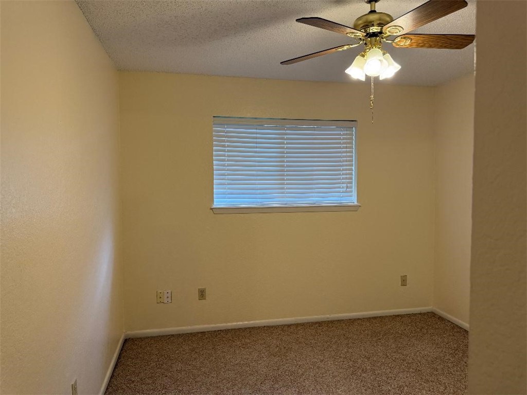 110 Timberview Drive Portland, TX 78374 - Photo 27 of 30 an empty room with a window and a fan
