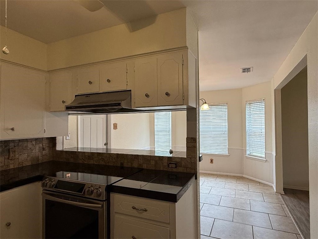 110 Timberview Drive Portland, TX 78374 - Photo 6 of 30 a kitchen with granite countertop a stove and a sink