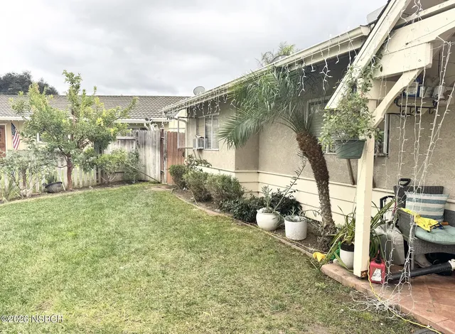 a view of yard with swimming pool and trees
