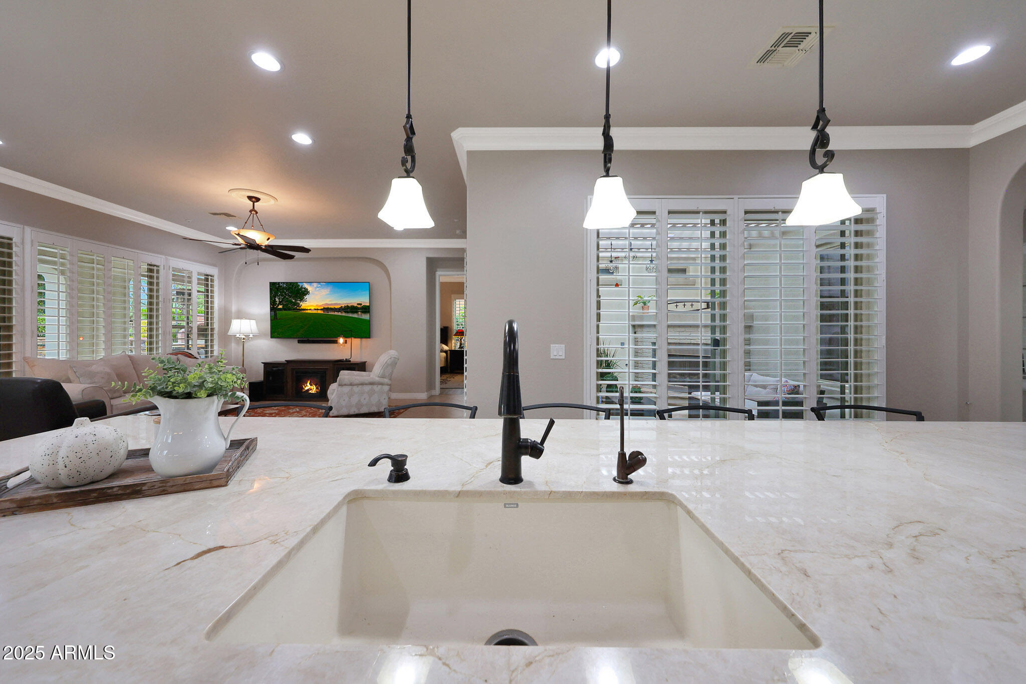 12920 West Roy Rogers Road Peoria, AZ 85383 - Photo 16 of 85 a large kitchen with kitchen island a sink a stove and a chandelier