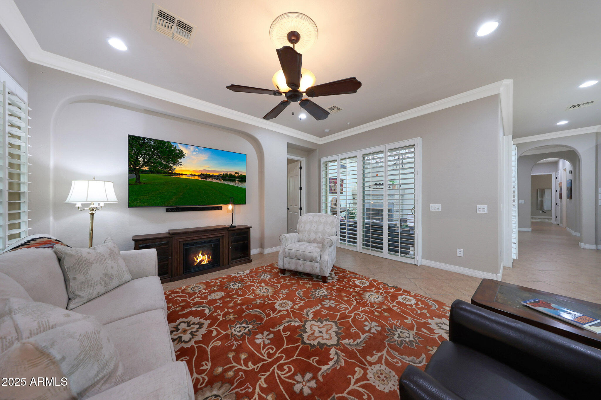 12920 West Roy Rogers Road Peoria, AZ 85383 - Photo 20 of 85 a living room with furniture and a flat screen tv