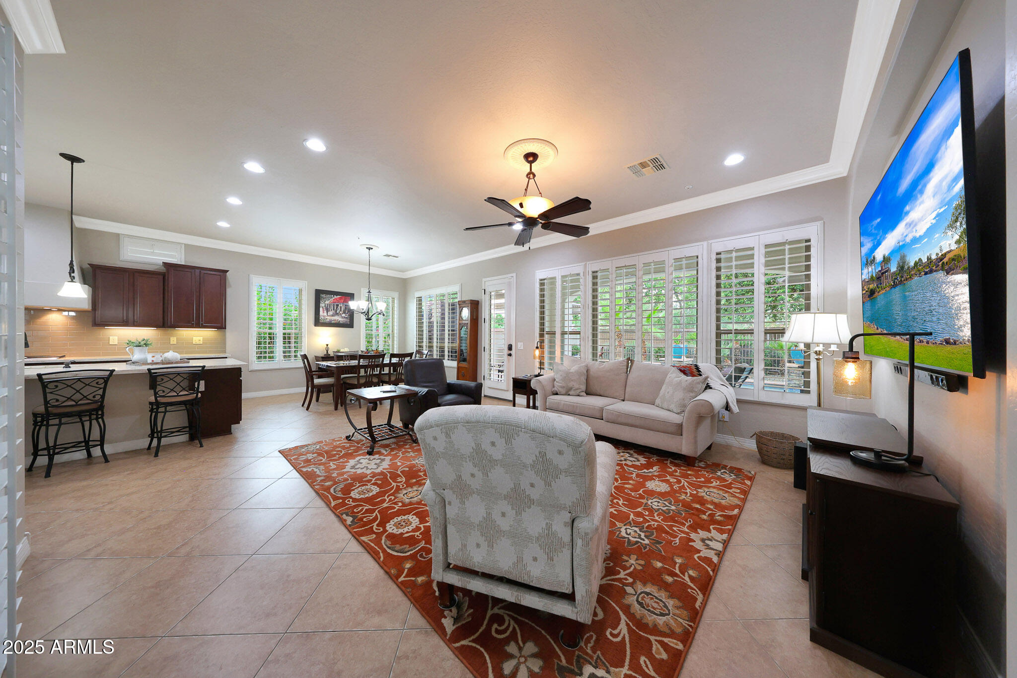 12920 West Roy Rogers Road Peoria, AZ 85383 - Photo 21 of 85 a living room with fireplace furniture and a large window