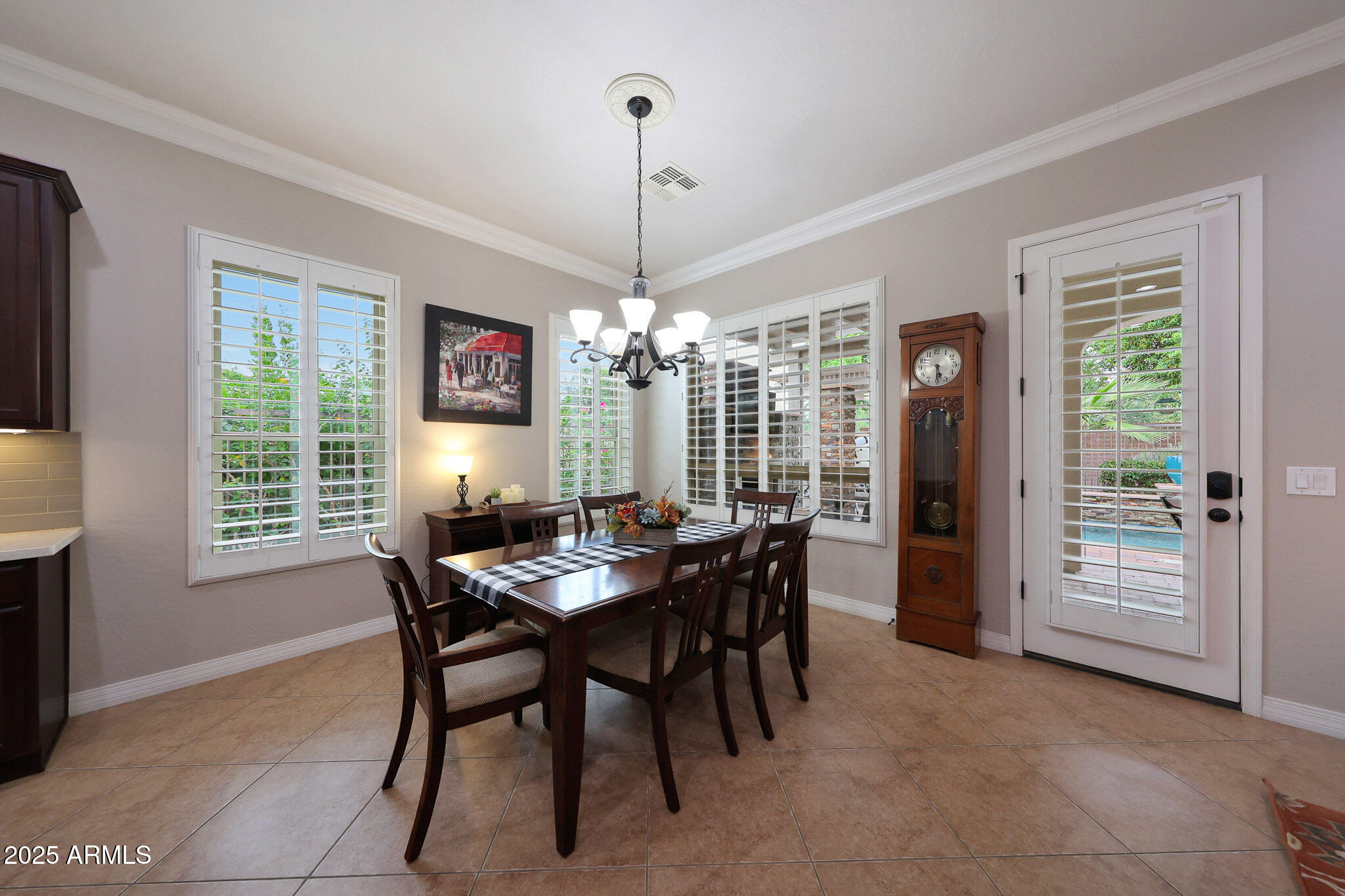 12920 West Roy Rogers Road Peoria, AZ 85383 - Photo 26 of 85 a view of a dining room with furniture window and outside view