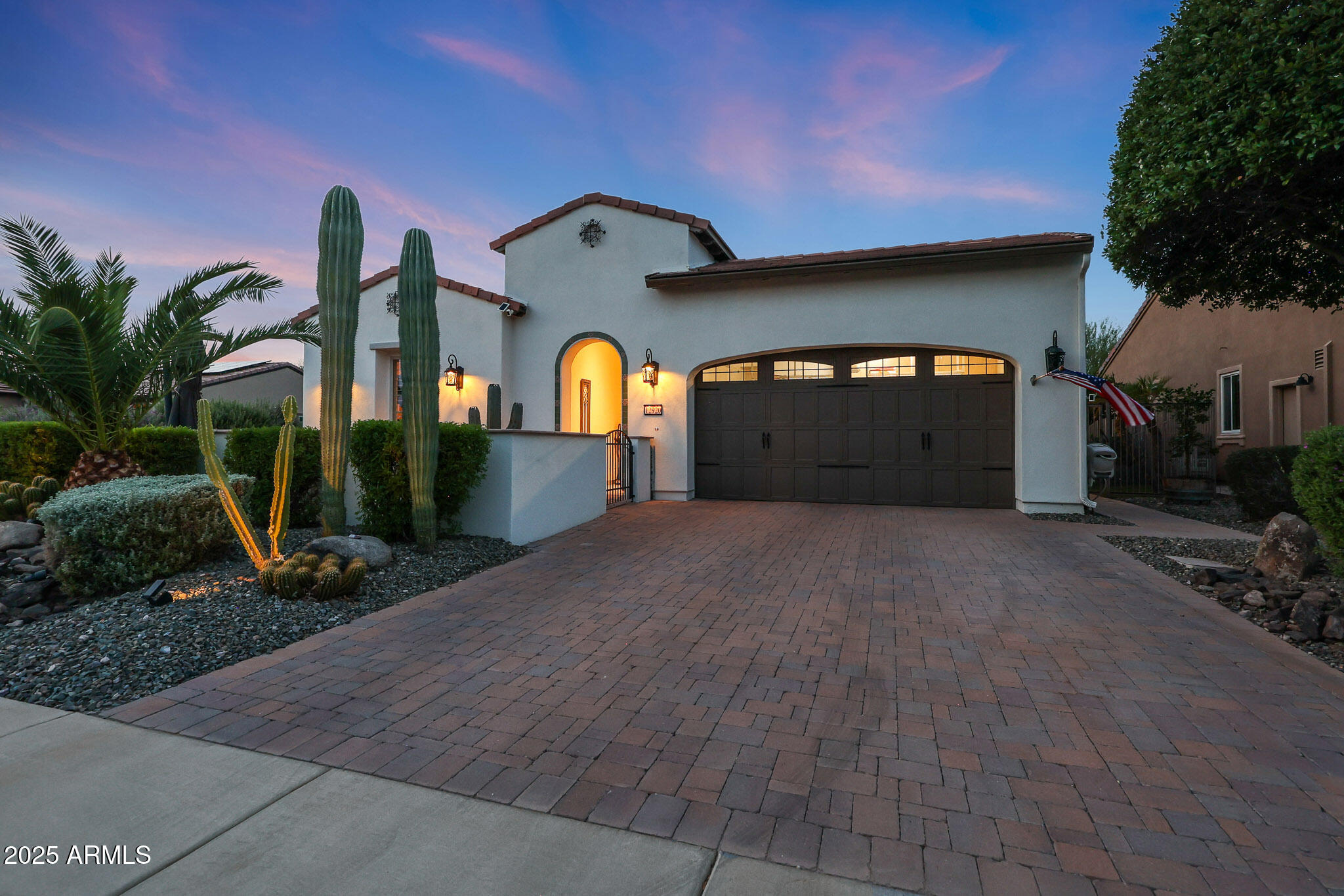 12920 West Roy Rogers Road Peoria, AZ 85383 - Photo 2 of 85 a front view of a house with a yard