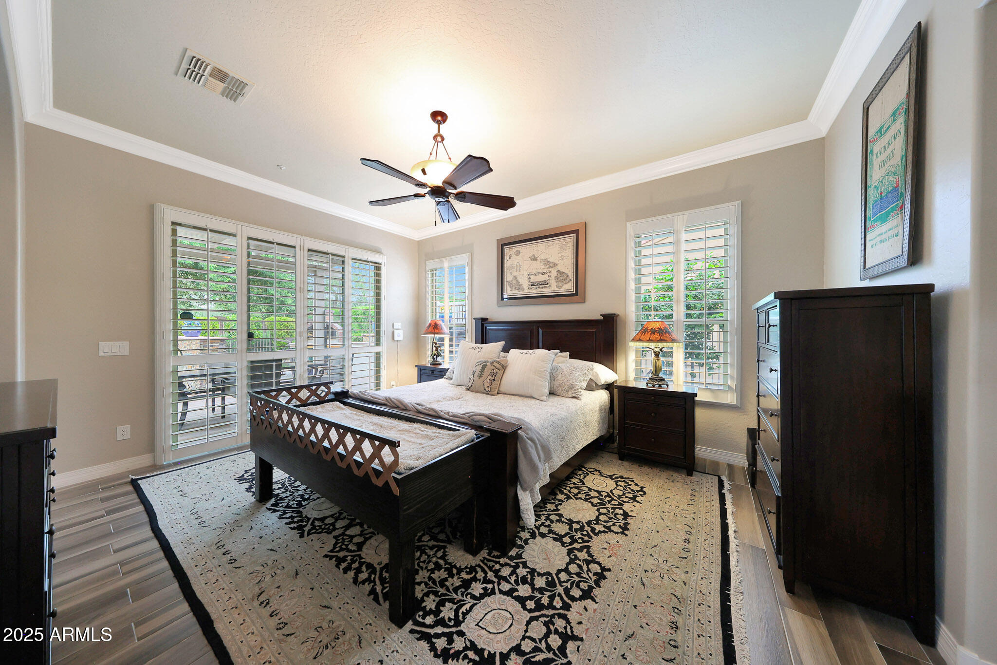 12920 West Roy Rogers Road Peoria, AZ 85383 - Photo 32 of 85 a bed sitting in a bedroom next to a window