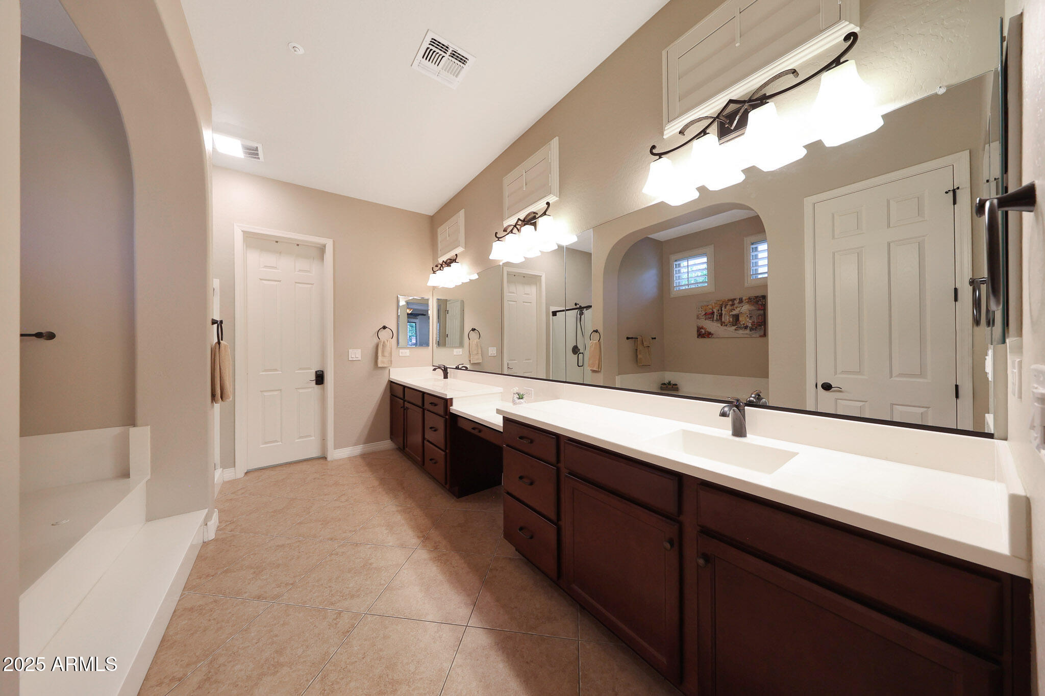 12920 West Roy Rogers Road Peoria, AZ 85383 - Photo 34 of 85 a spacious bathroom with a double vanity sink mirror and double