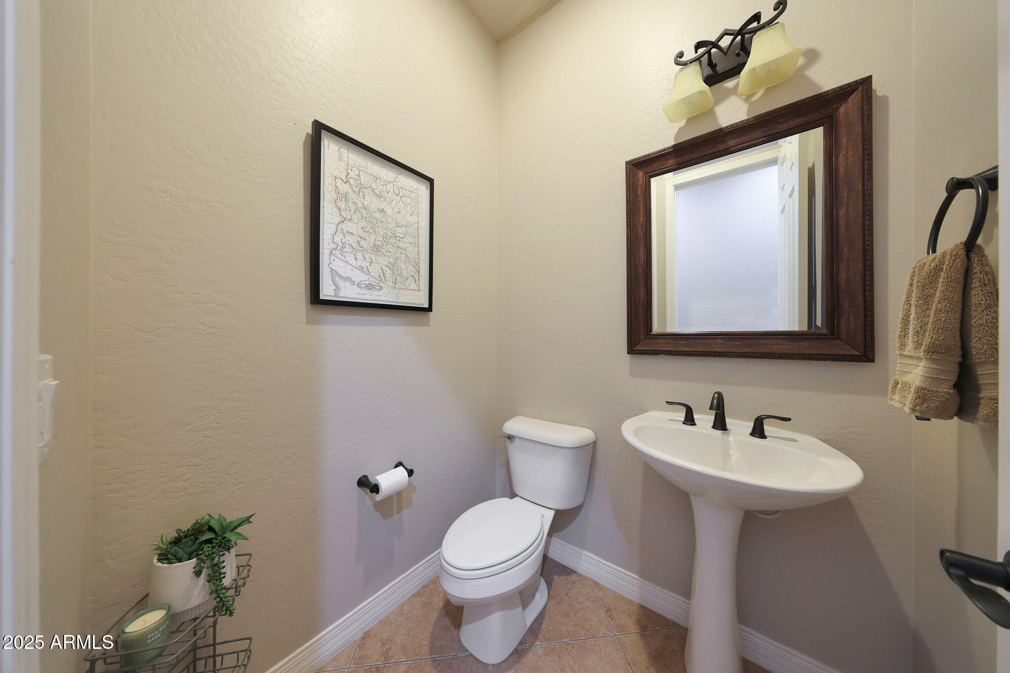 12920 West Roy Rogers Road Peoria, AZ 85383 - Photo 46 of 85 a bathroom with a toilet sink and mirror