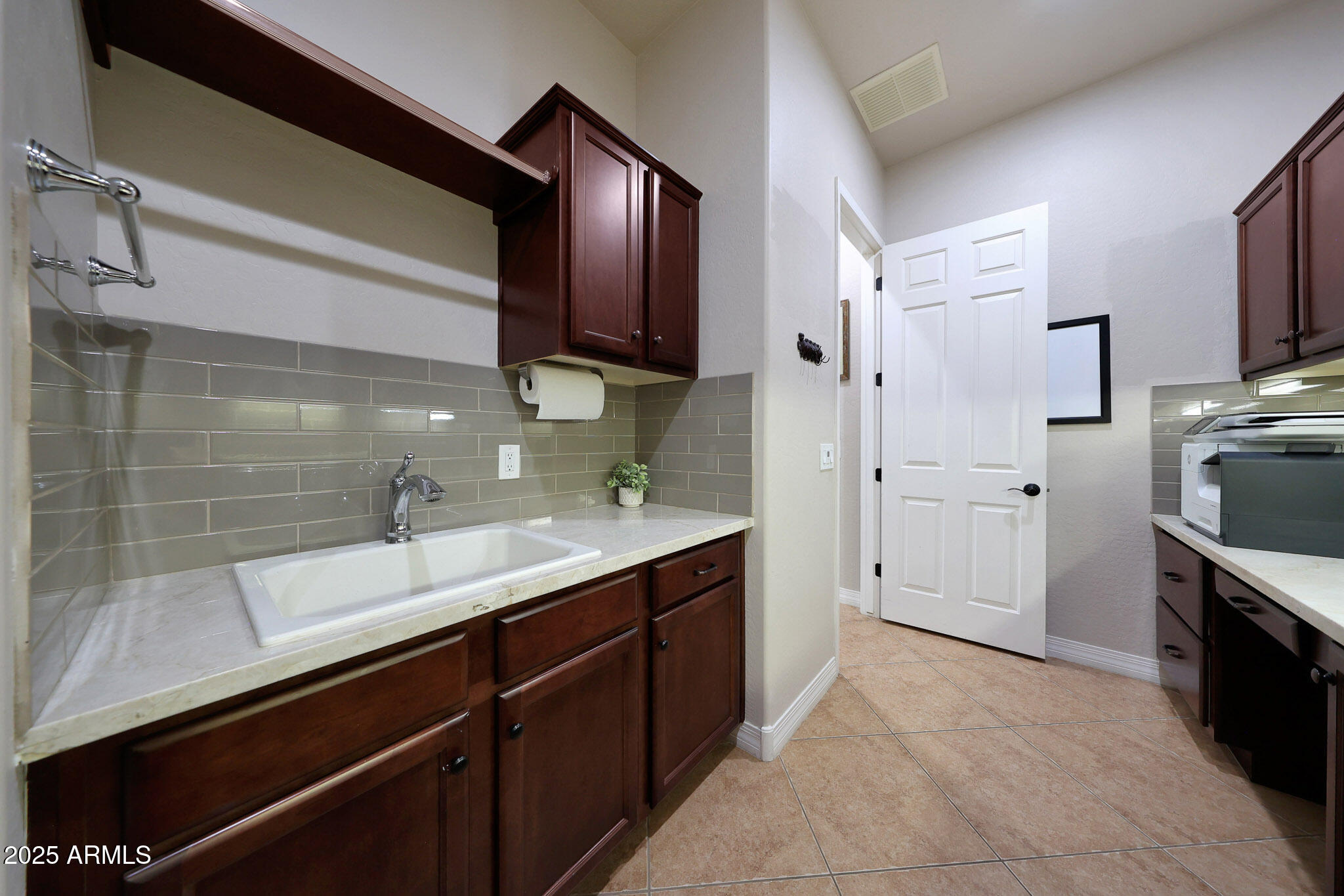 12920 West Roy Rogers Road Peoria, AZ 85383 - Photo 48 of 85 a kitchen with stainless steel appliances granite countertop a sink stove and refrigerator