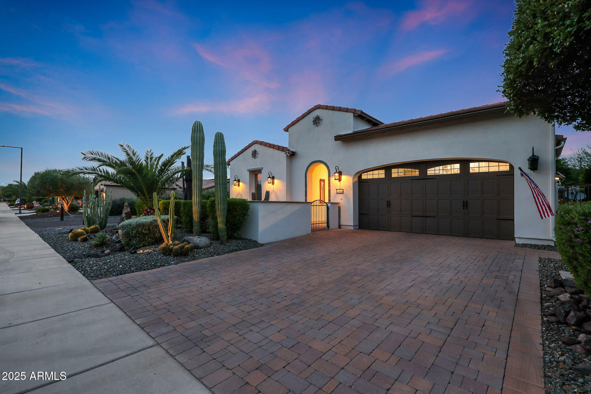 12920 West Roy Rogers Road Peoria, AZ 85383 - Photo 4 of 85 a front view of a house with a yard and a garage