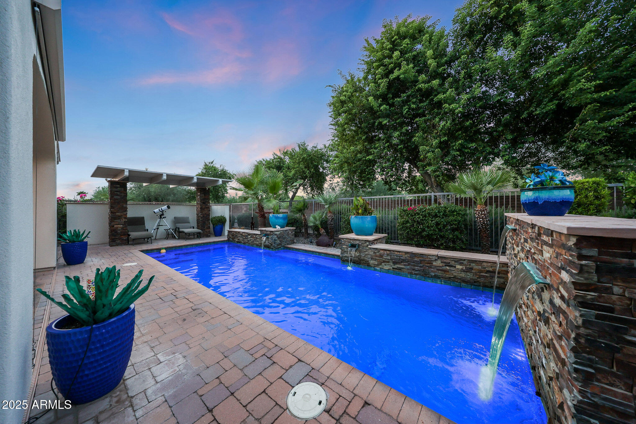 12920 West Roy Rogers Road Peoria, AZ 85383 - Photo 52 of 85 a view of a swimming pool with a patio