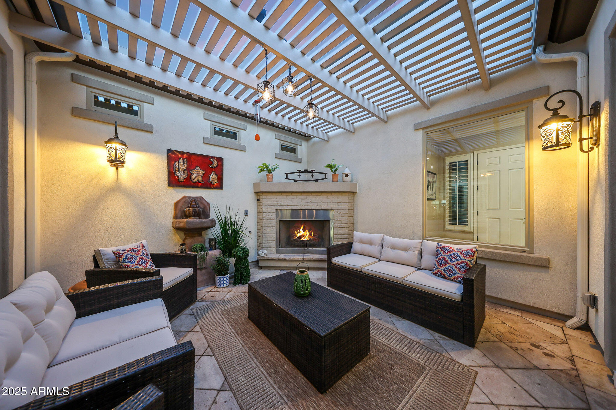 12920 West Roy Rogers Road Peoria, AZ 85383 - Photo 57 of 85 a living room with furniture and a fireplace