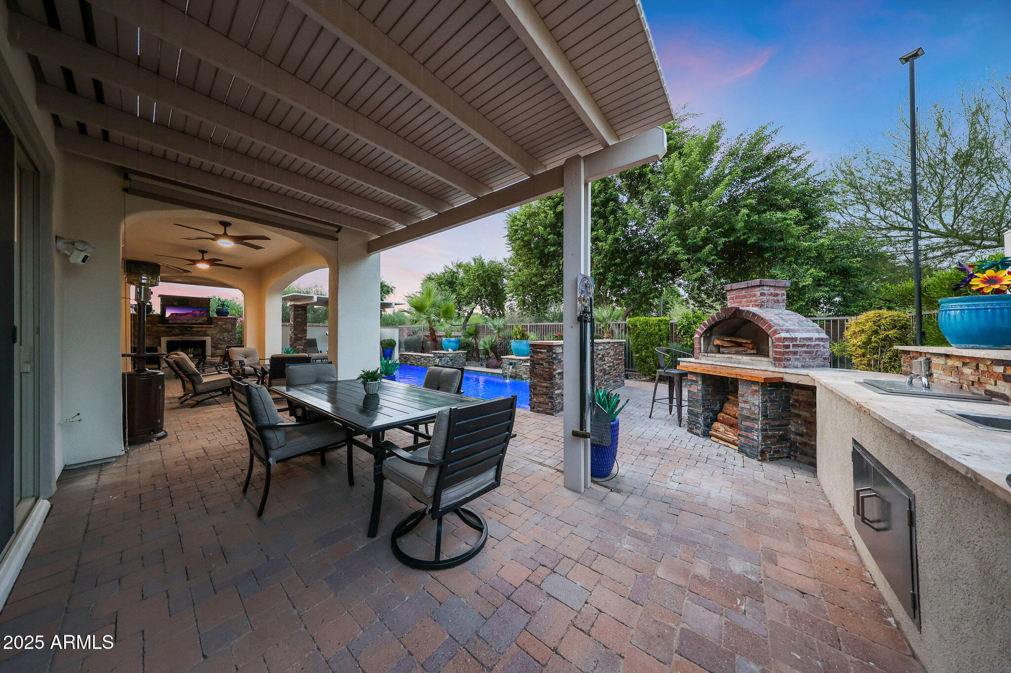 12920 West Roy Rogers Road Peoria, AZ 85383 - Photo 60 of 85 a dining room with furniture and a garden