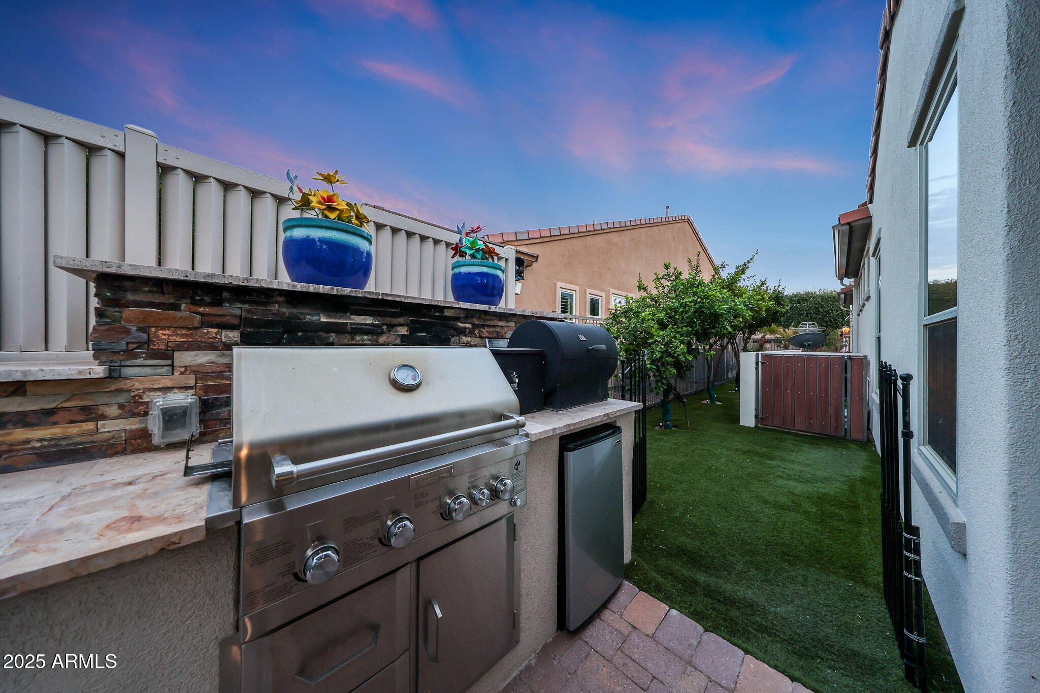 12920 West Roy Rogers Road Peoria, AZ 85383 - Photo 62 of 85 a view of backyard with barbeque grill and outdoor seating