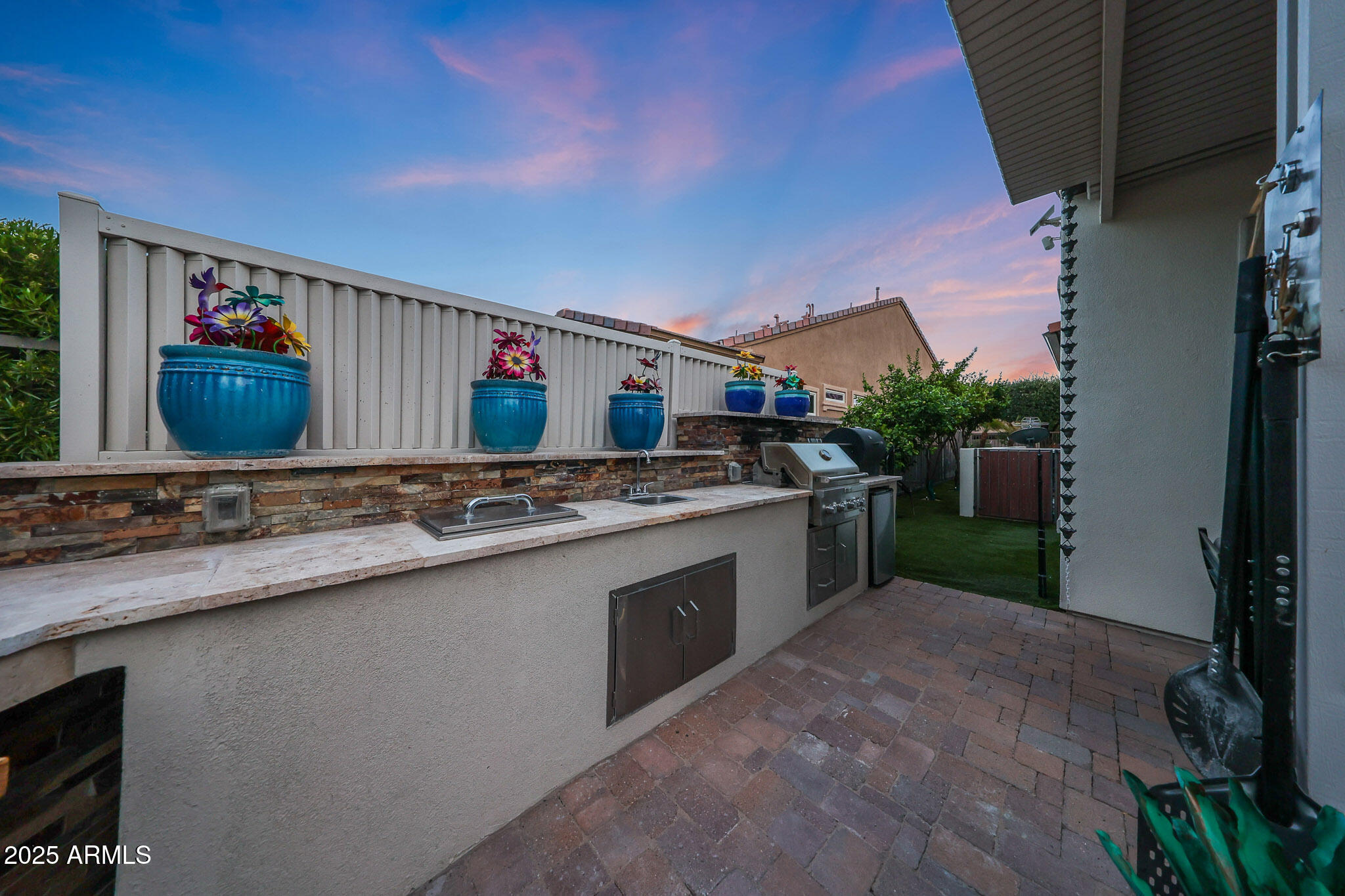 12920 West Roy Rogers Road Peoria, AZ 85383 - Photo 63 of 85 a kitchen with stainless steel appliances a sink stove and cabinets