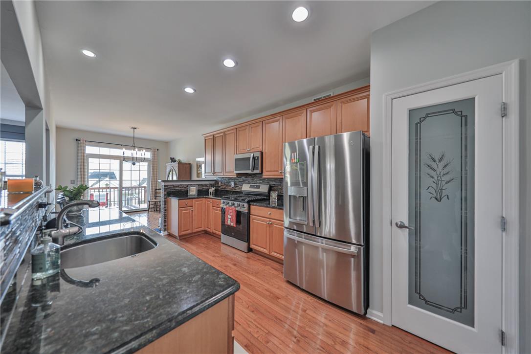 163 Muirfield Way Easton, PA 18042 - Photo 10 of 48 a kitchen with stainless steel appliances granite countertop a refrigerator a sink a stove and island