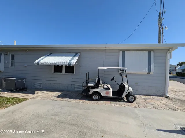 a kitchen with stainless steel appliances granite countertop a refrigerator a stove and a sink