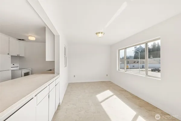 a view of a kitchen with windows