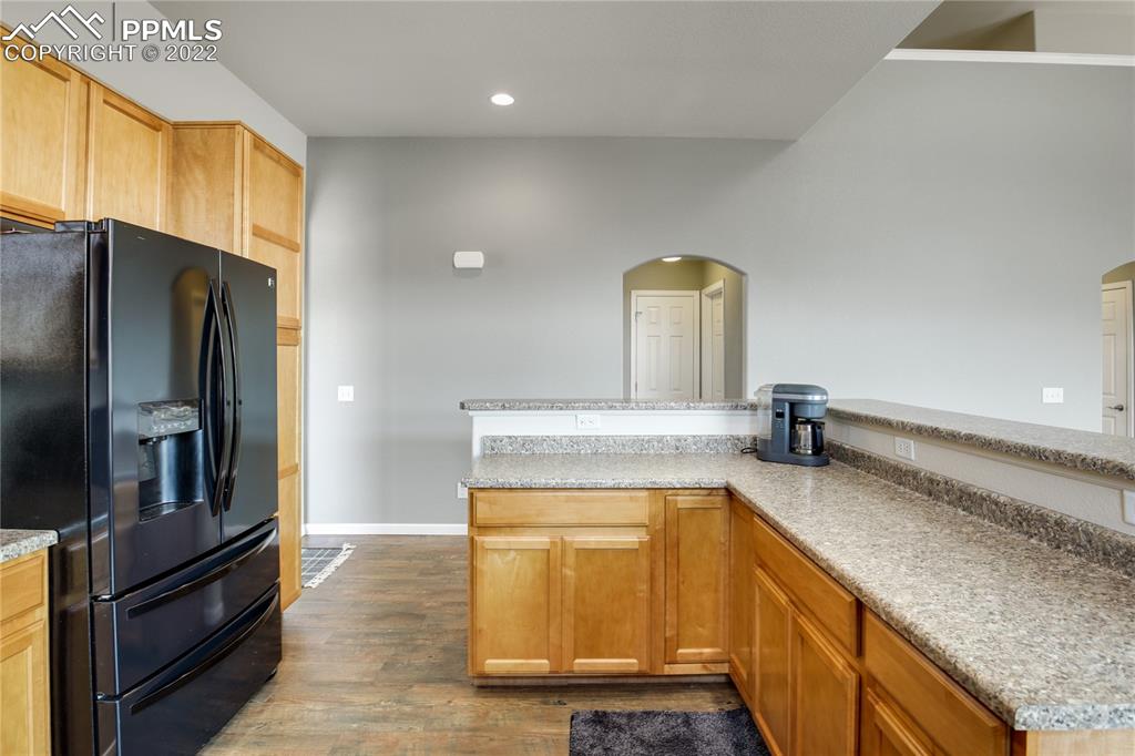 6446 Dancing Moon Way Colorado Springs, CO 80911 - Photo 11 of 42 a kitchen with a sink appliances and cabinets