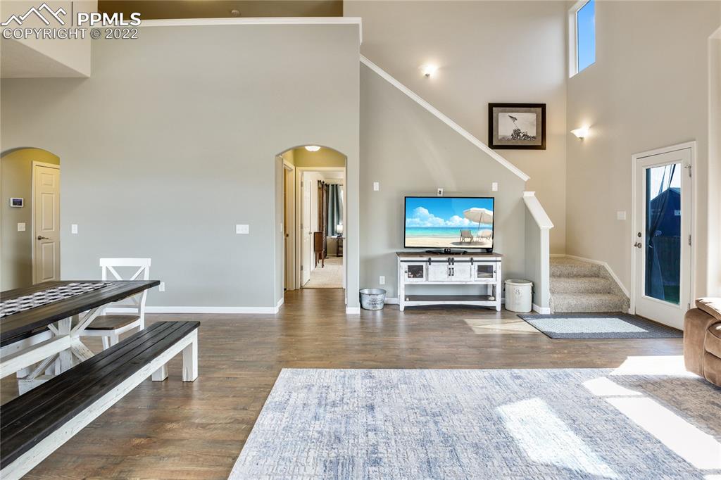 6446 Dancing Moon Way Colorado Springs, CO 80911 - Photo 13 of 42 a living room with furniture and a flat screen tv