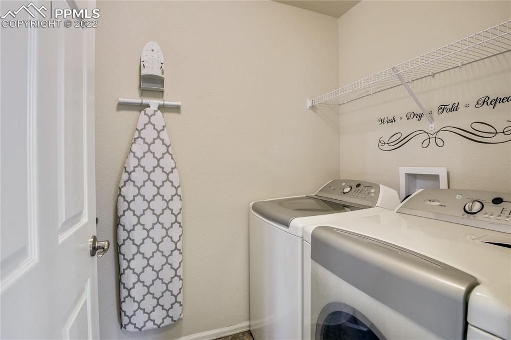 6446 Dancing Moon Way Colorado Springs, CO 80911 - Photo 18 of 42 a utility room with dryer and washer