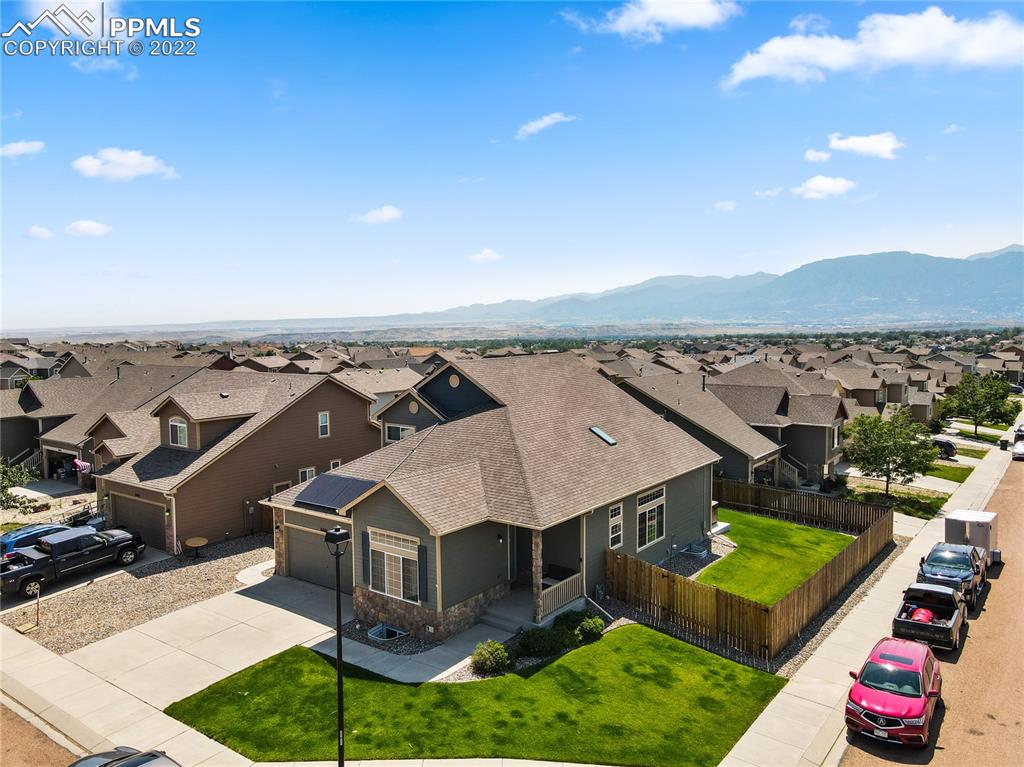 6446 Dancing Moon Way Colorado Springs, CO 80911 - Photo 35 of 42 an aerial view of a house with a garden