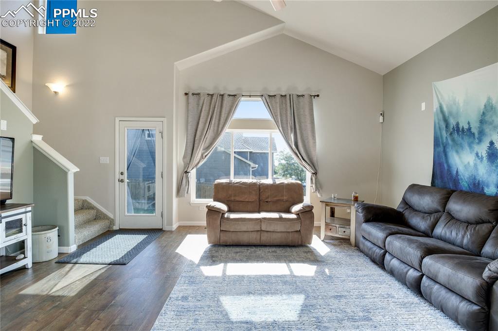 6446 Dancing Moon Way Colorado Springs, CO 80911 - Photo 7 of 42 a living room with furniture and a window