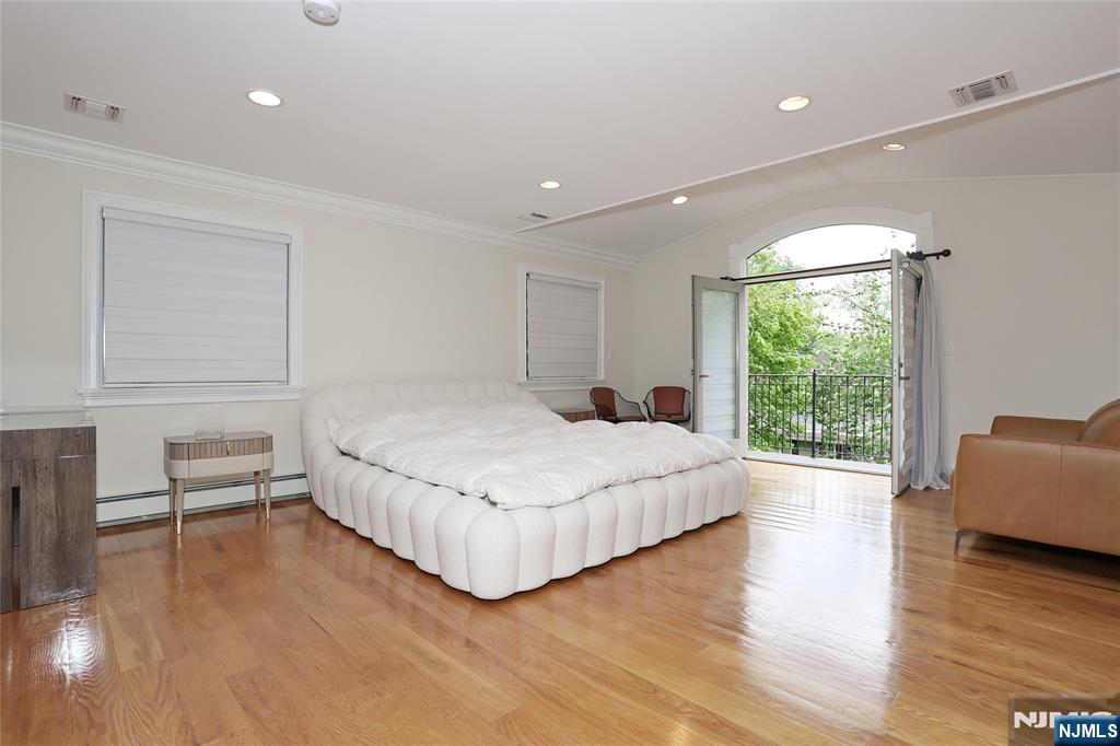 65 Ross Avenue Demarest, NJ 07627 - Photo 23 of 48 a bedroom with a bed and wooden floor