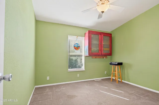 a room with furniture and white walls